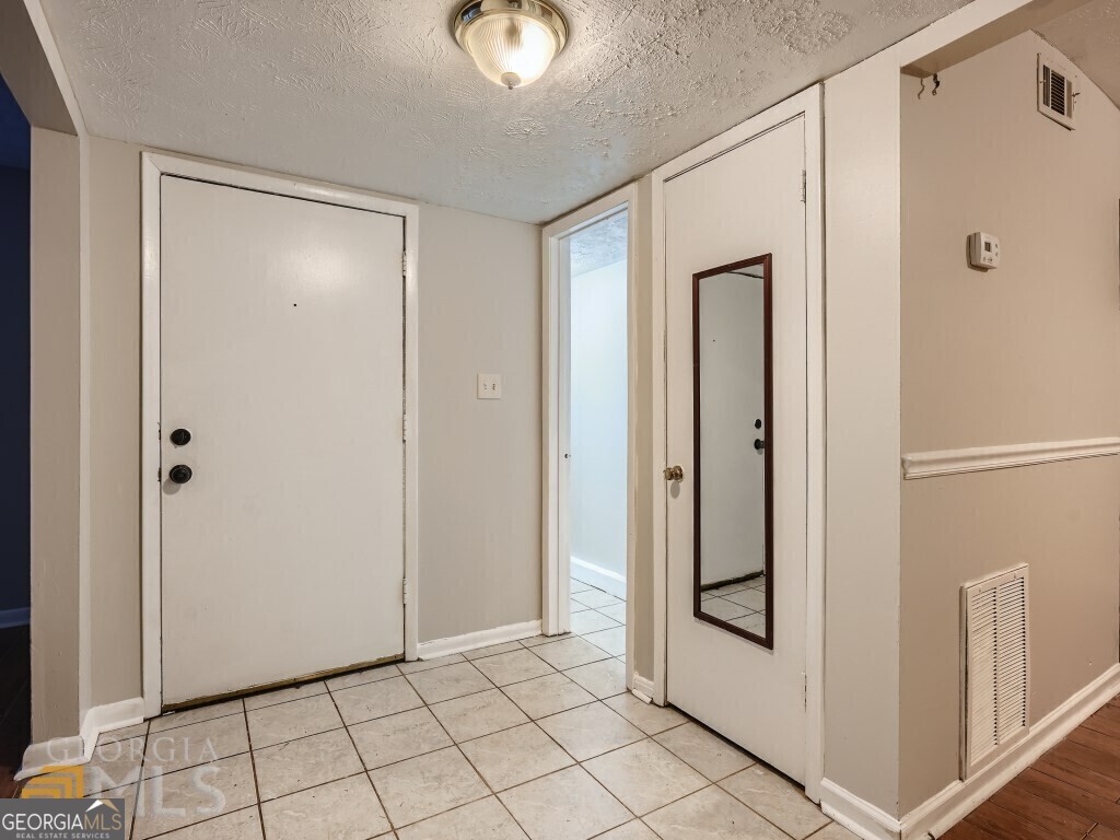 967 Pine Hollow Road Austell, GA 30168 - Photo 5 of 26 a view of a hallway with closet area