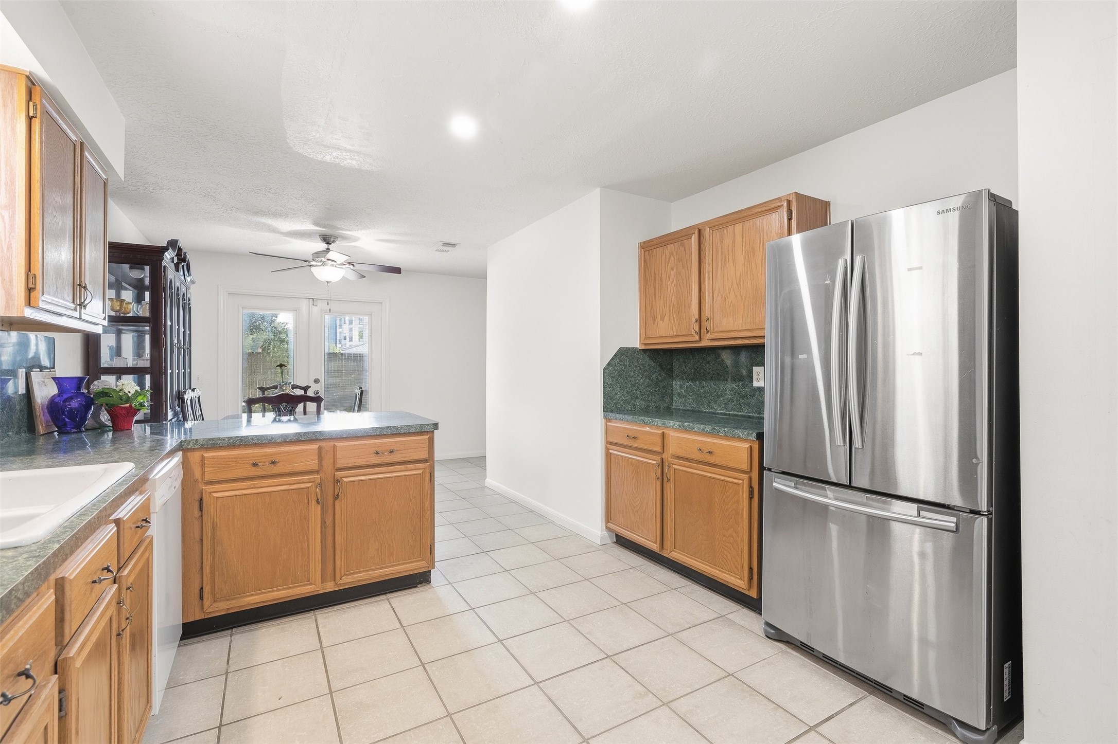 28723 Sedgefield Street Spring, TX 77386 - Photo 8 of 20 a kitchen with stainless steel appliances granite countertop a refrigerator and a sink