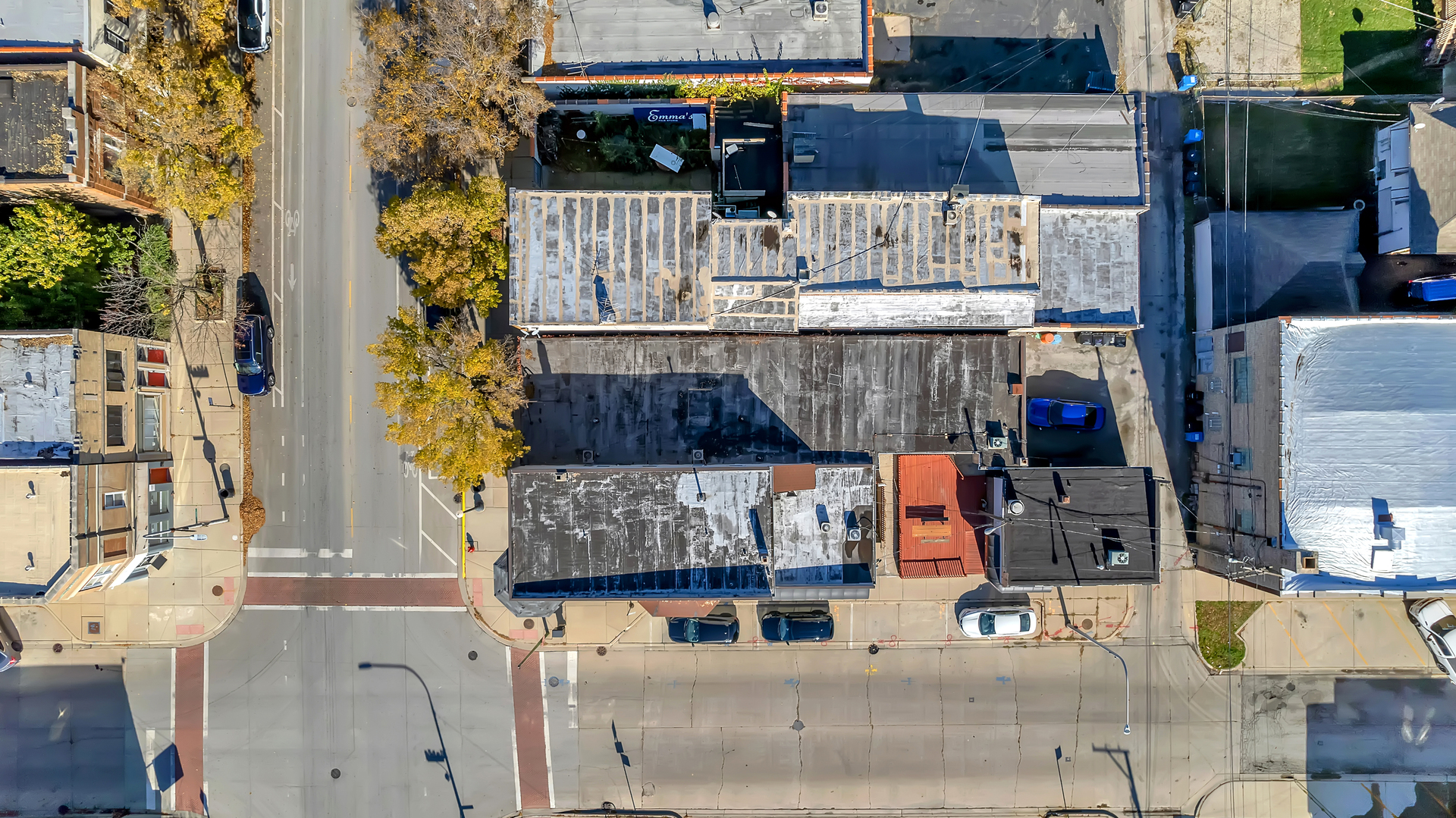 aerial view of a house with street
