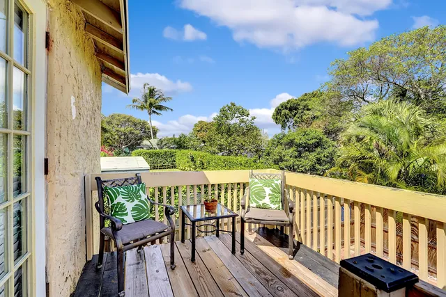 a view of a balcony with chairs