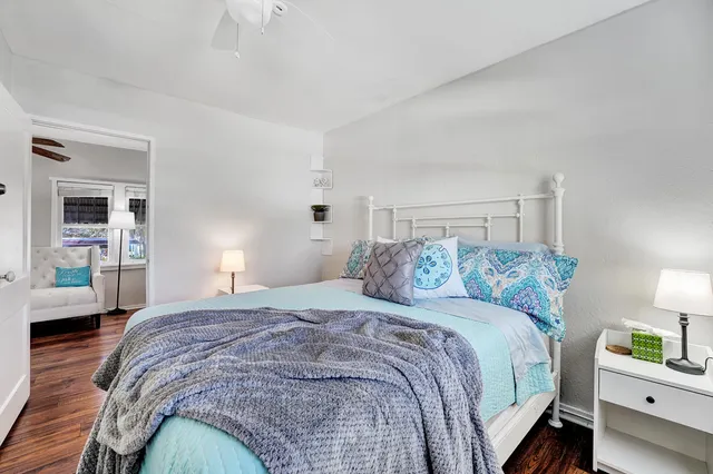 a bedroom with a bed and a couch