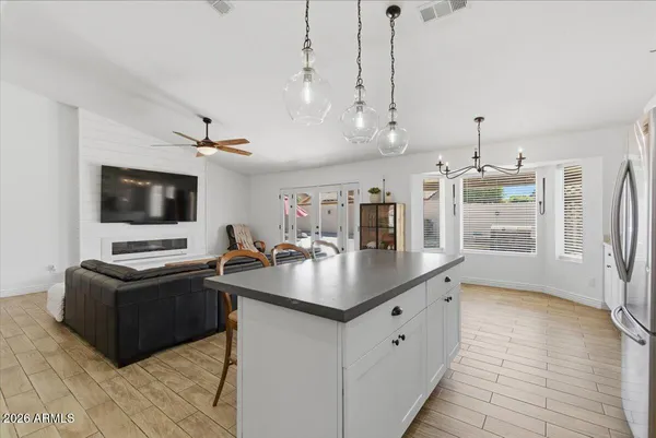 a kitchen with stainless steel appliances granite countertop a sink stove and microwave