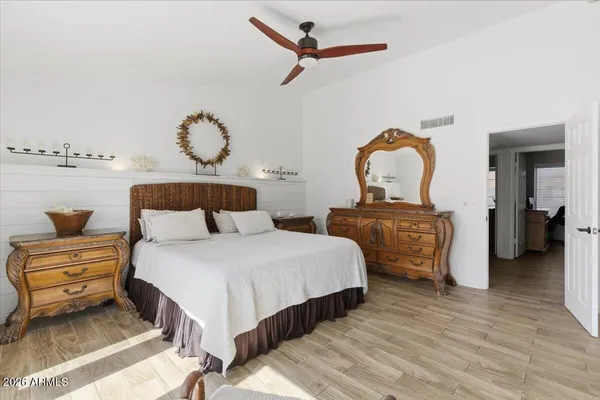 a bathroom with a double vanity and a mirror