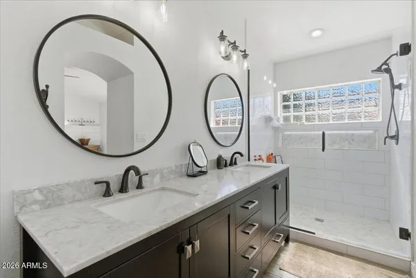 a bathroom with a sink a toilet and shower curtain