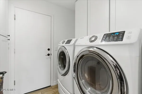 a front view of a house with swimming pool having outdoor seating