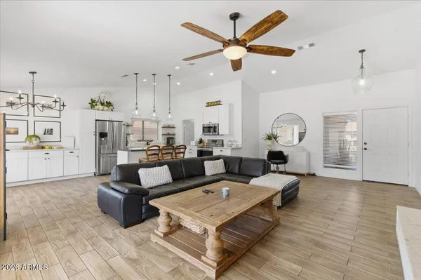 a living room with furniture or outdoor view and a chandelier