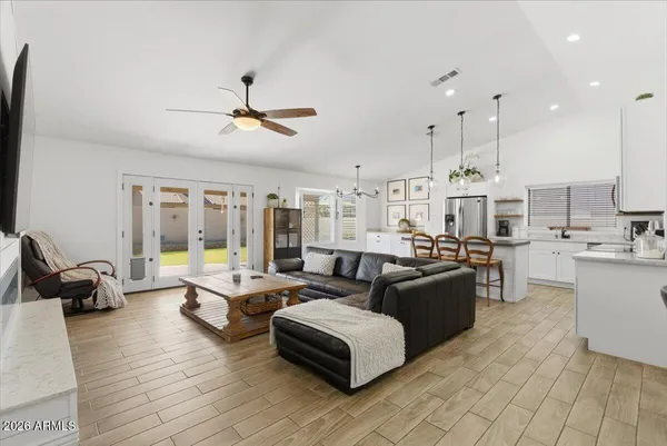 a kitchen with sink a stove and cabinets