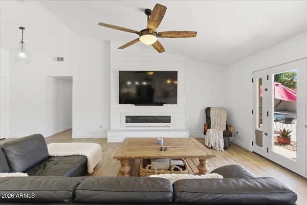 a kitchen with stainless steel appliances granite countertop a sink a stove and a refrigerator