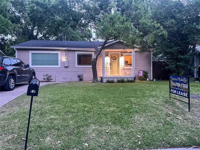 a front view of house with yard and entertaining space