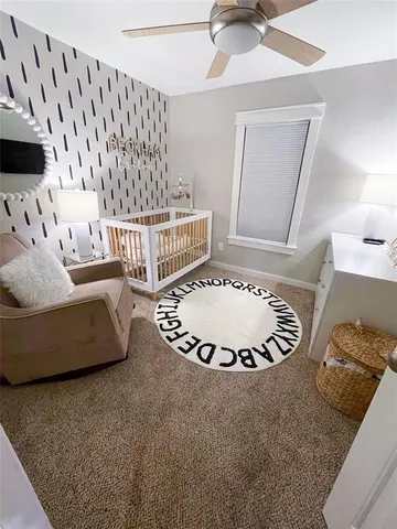 a living room with a couch and a chandelier