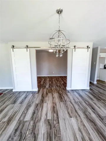 a view of wooden floor cabinets and a wooden floor
