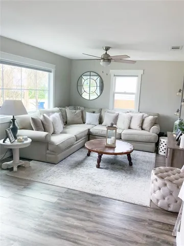 a living room with furniture and a large window