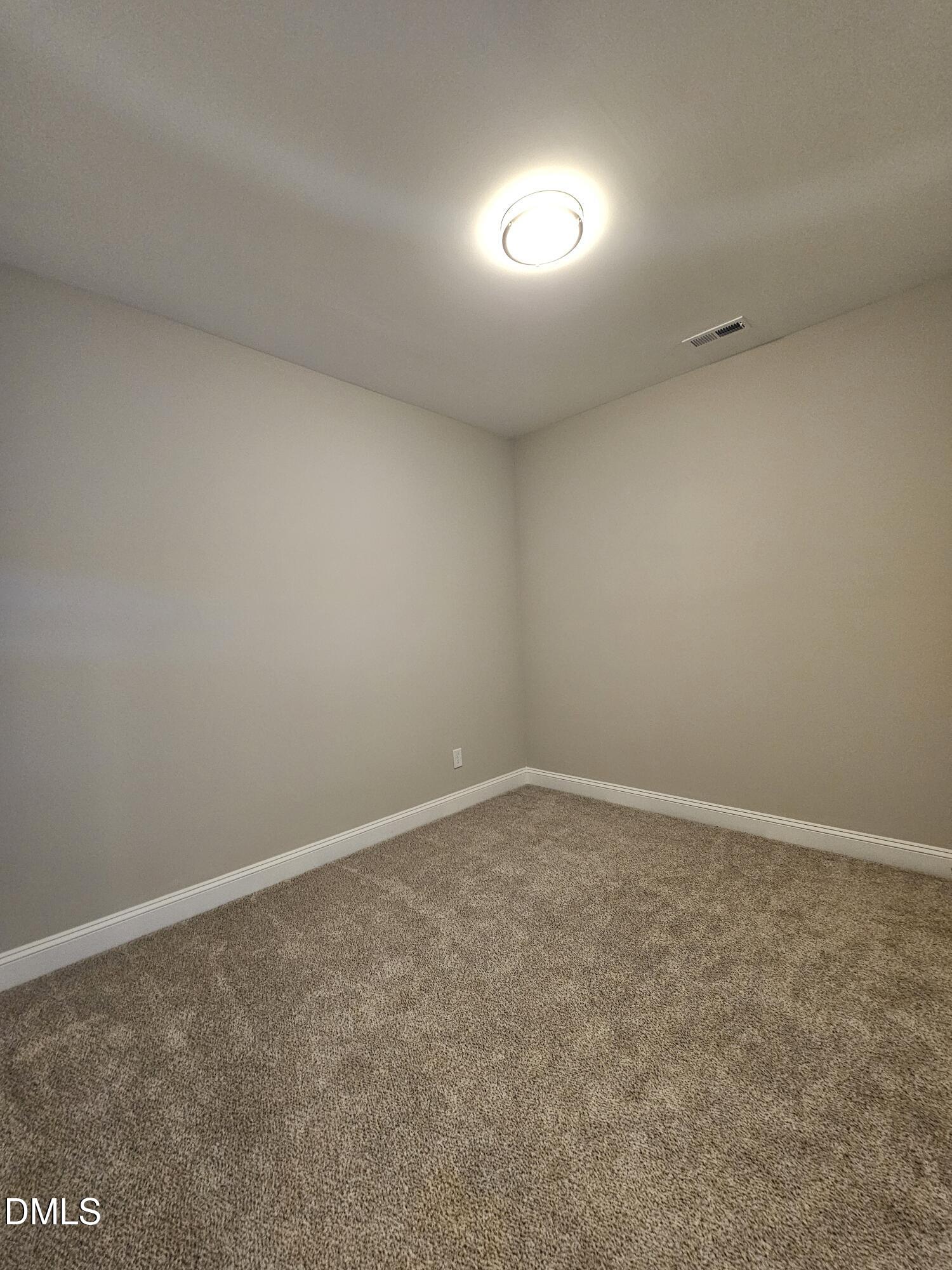 7994 Humie Olive Road Apex, NC 27502 - Photo 13 of 14 a view of an empty room