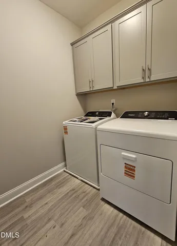 a view of cabinets with wooden floor