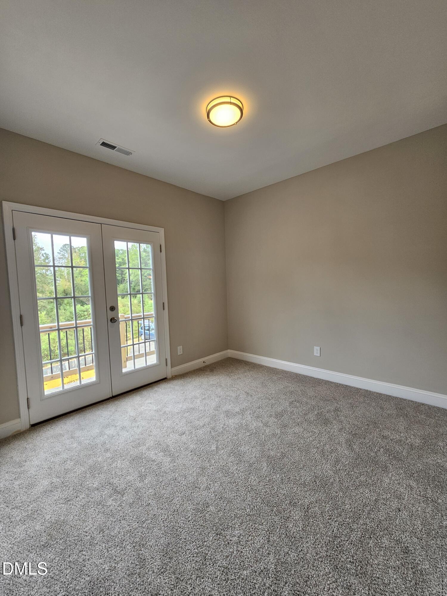7994 Humie Olive Road Apex, NC 27502 - Photo 2 of 14 a view of an empty room with a window
