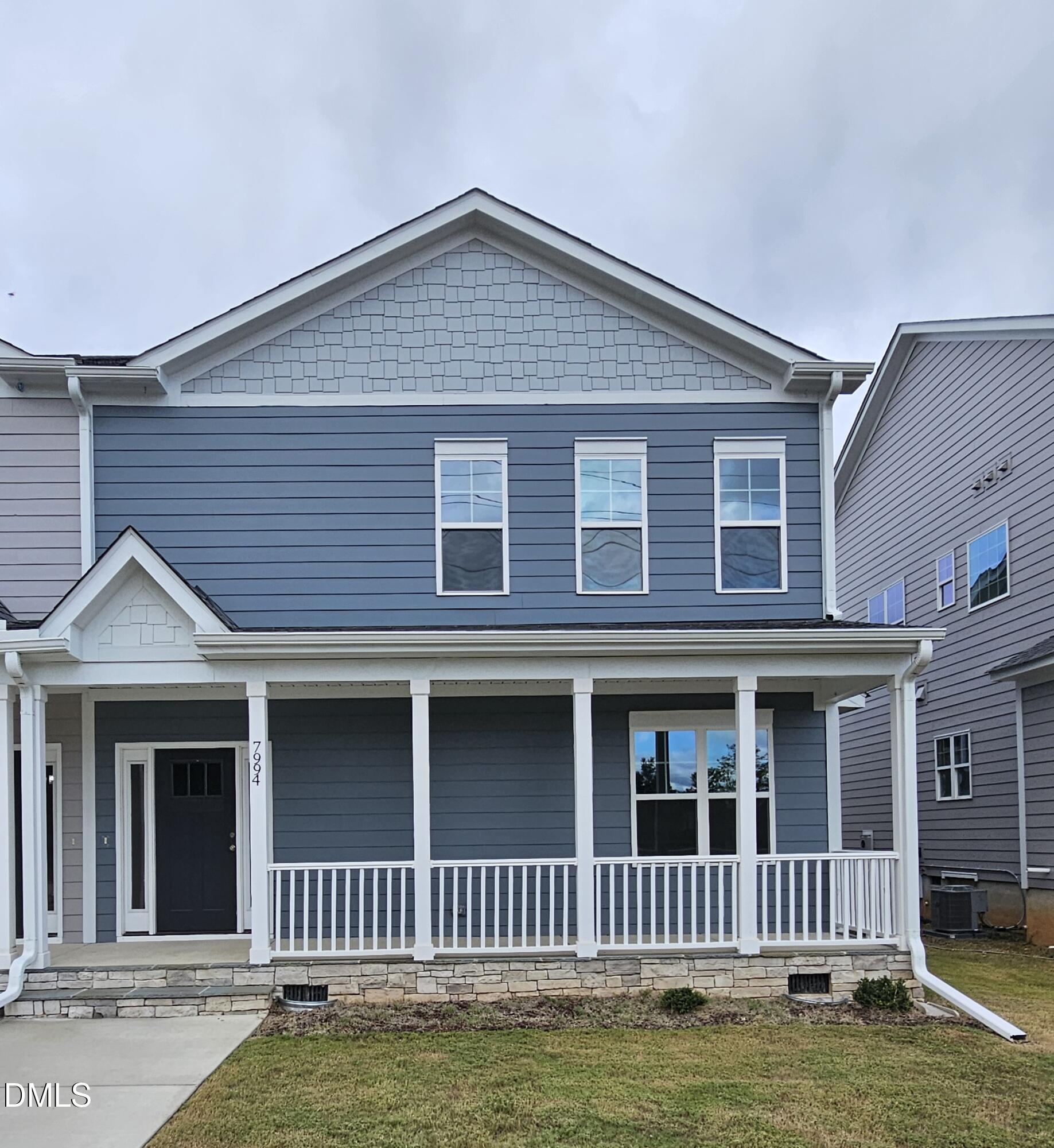 7994 Humie Olive Road Apex, NC 27502 - Photo 8 of 14 a front view of a house with a small yard