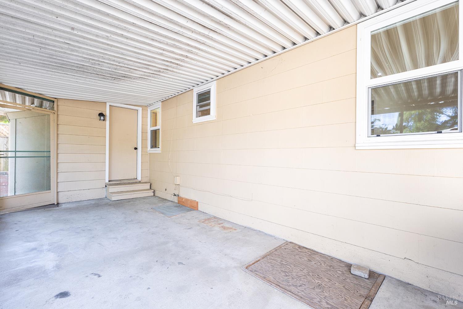 18090 Las Lomas Road Sonoma, CA 95476 - Photo 37 of 37 an empty room with windows