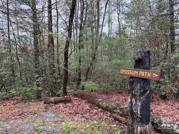 a wooden bench sitting in a yard
