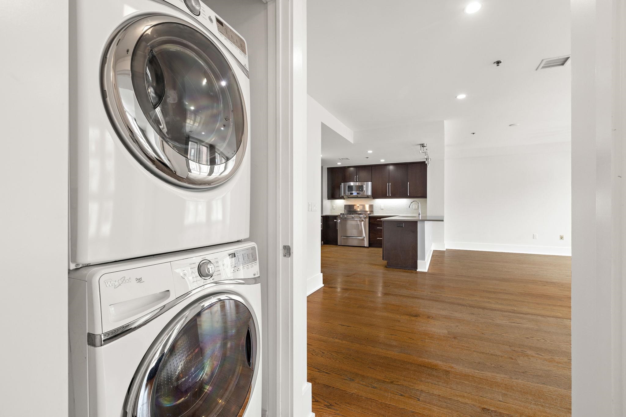 89 Jefferson Street, Unit 4B Hoboken, NJ 07030 - Photo 14 of 16 a view of a kitchen with a washer and dryer