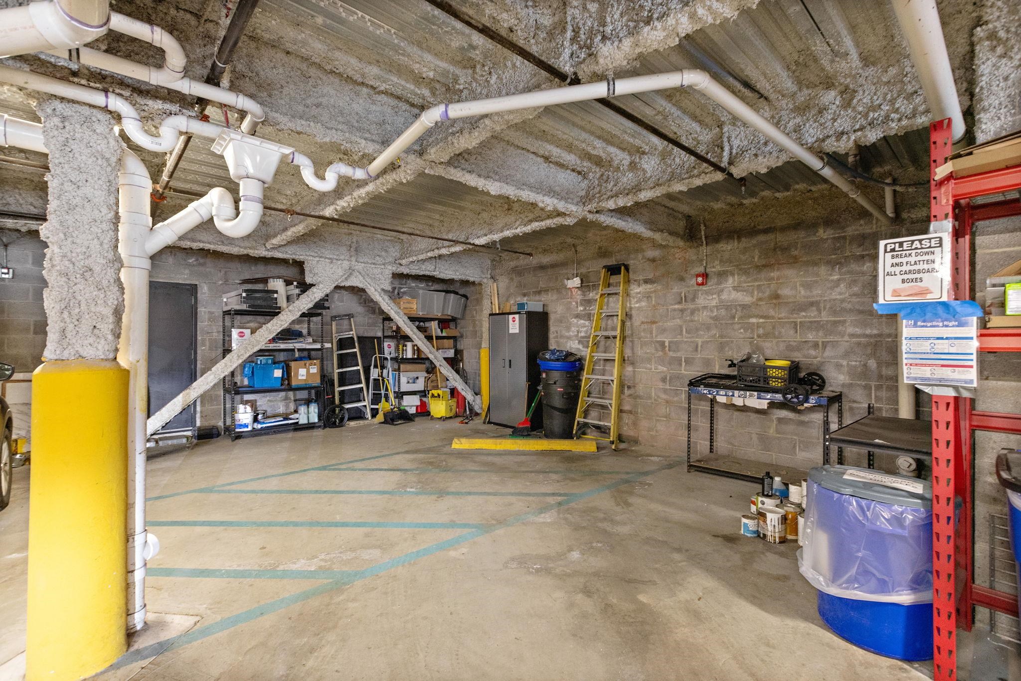 89 Jefferson Street, Unit 4B Hoboken, NJ 07030 - Photo 15 of 16 a view of a garage with a table and chairs