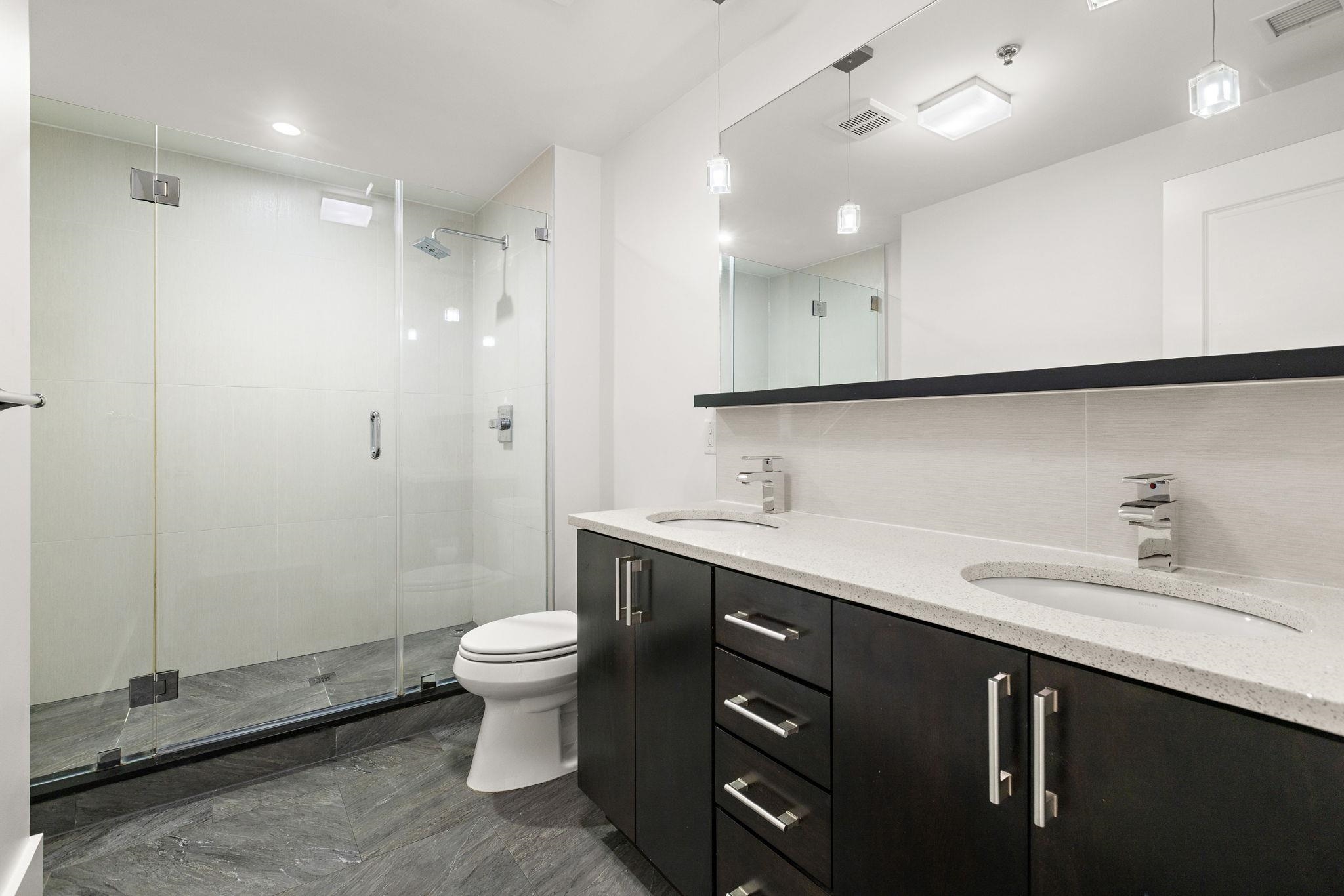 89 Jefferson Street, Unit 4B Hoboken, NJ 07030 - Photo 10 of 16 a bathroom with a sink toilet and a mirror