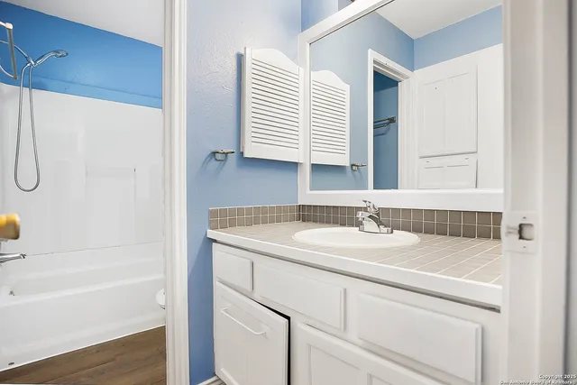 a bathroom with a bathtub and a toilet