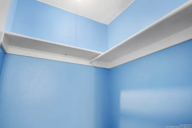 a bathroom with a sink toilet and a mirror