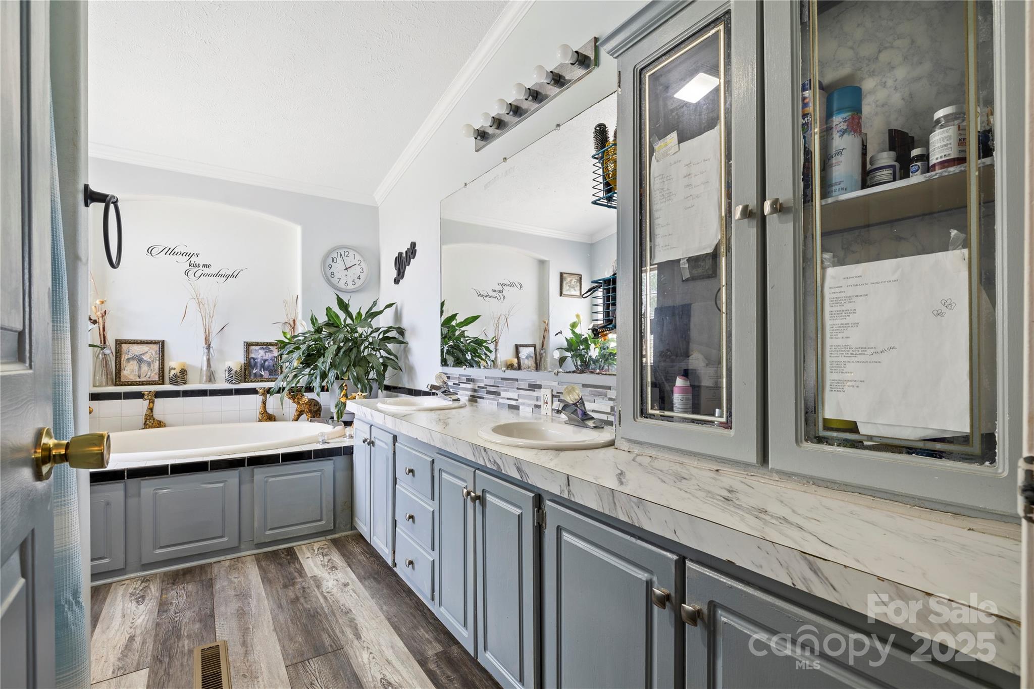 a large bathroom with a double vanity sink and a mirror
