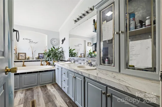 a large bathroom with a double vanity sink and a mirror