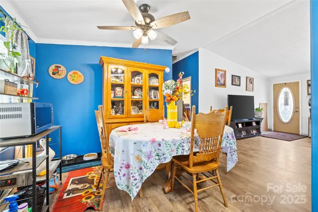 a bedroom with furniture and a flat screen tv