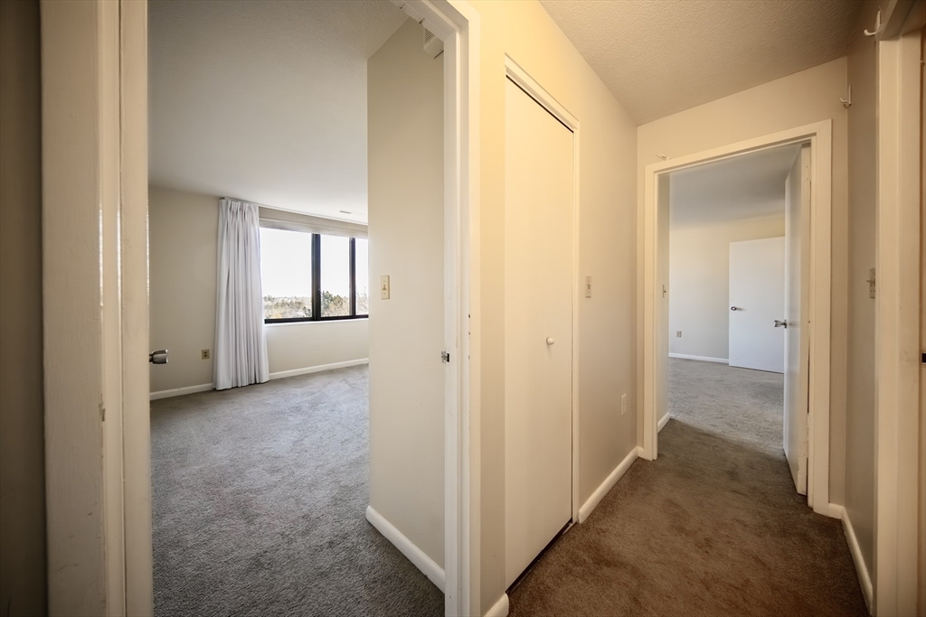 1002 Paradise Road, Unit PHE Swampscott, MA 01907 - Photo 15 of 23 a view of a hallway with wooden floor