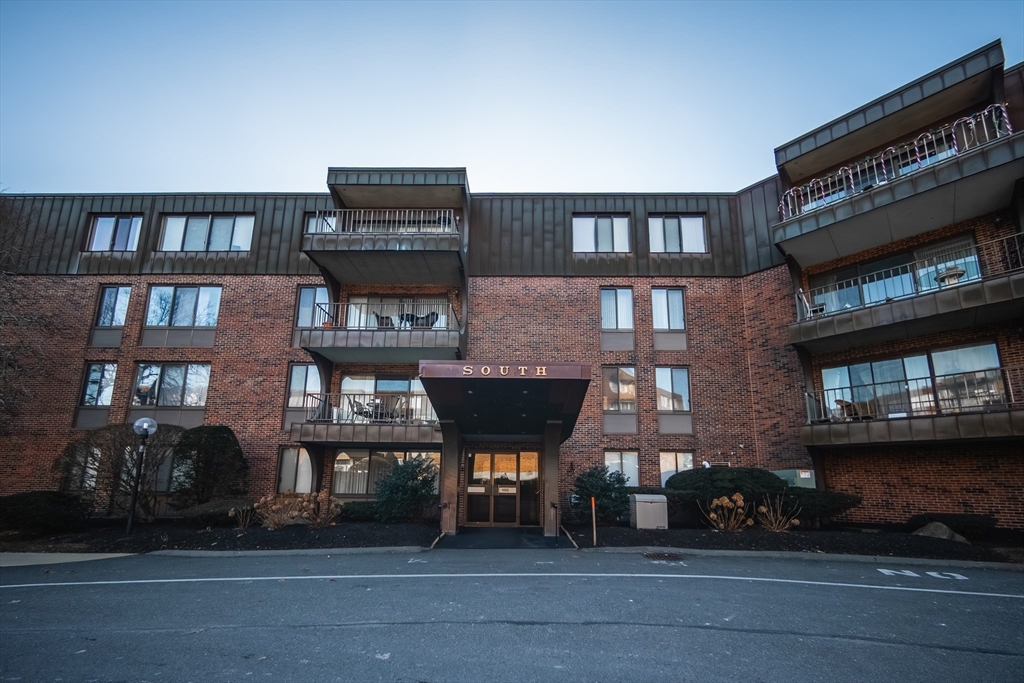 1002 Paradise Road, Unit PHE Swampscott, MA 01907 - Photo 2 of 23 a front view of a building with glass windows