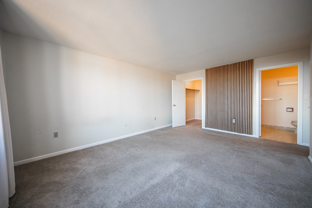 1002 Paradise Road, Unit PHE Swampscott, MA 01907 - Photo 9 of 23 a view of an empty room and a window