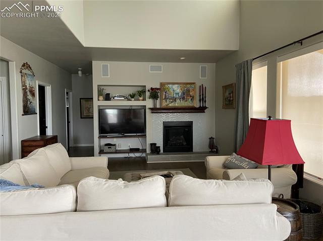 1225 Bowstring Road Monument, CO 80132 - Photo 1 of 2 Beautiful large main level family room with cozy fireplace and huge view windows!