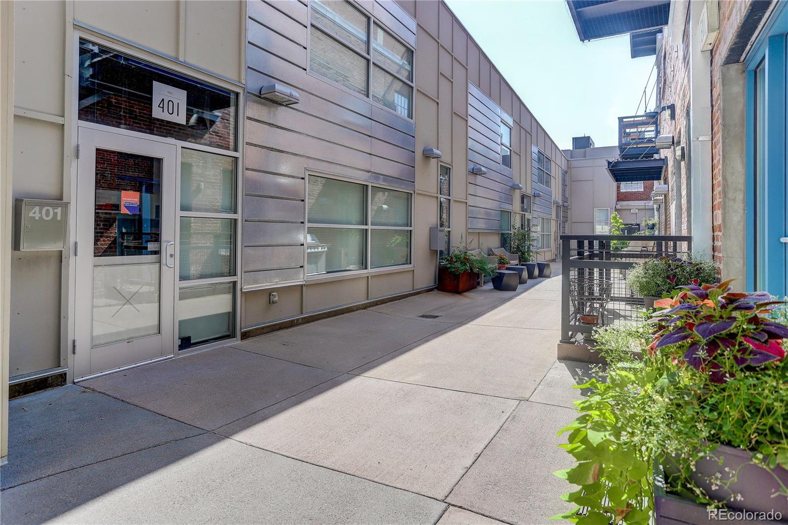 2500 Walnut Street, Unit 212 Denver, CO 80205 - Photo 3 of 39 a view of a building with potted plants