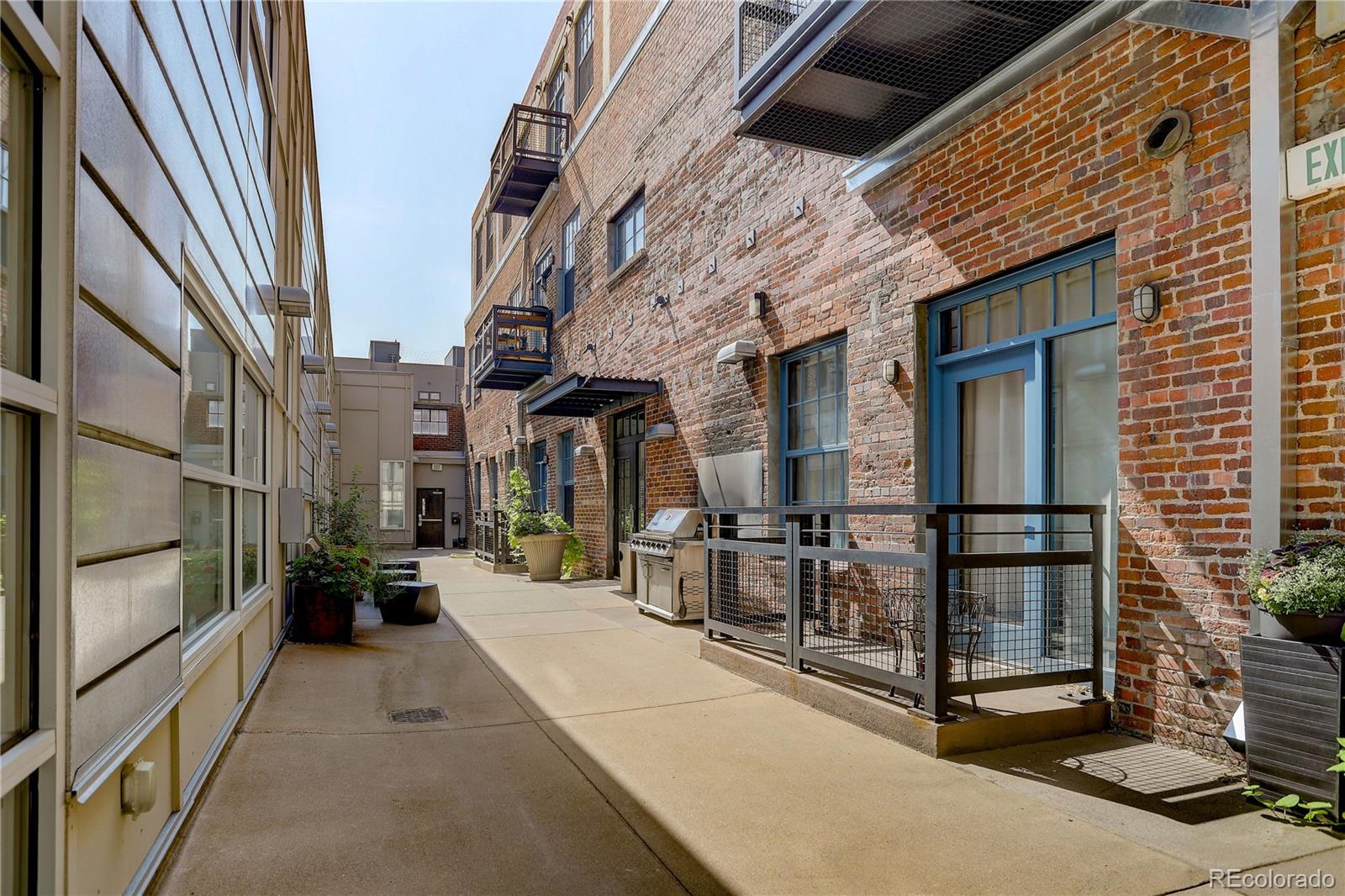 2500 Walnut Street, Unit 212 Denver, CO 80205 - Photo 4 of 39 a view of a building with car parked