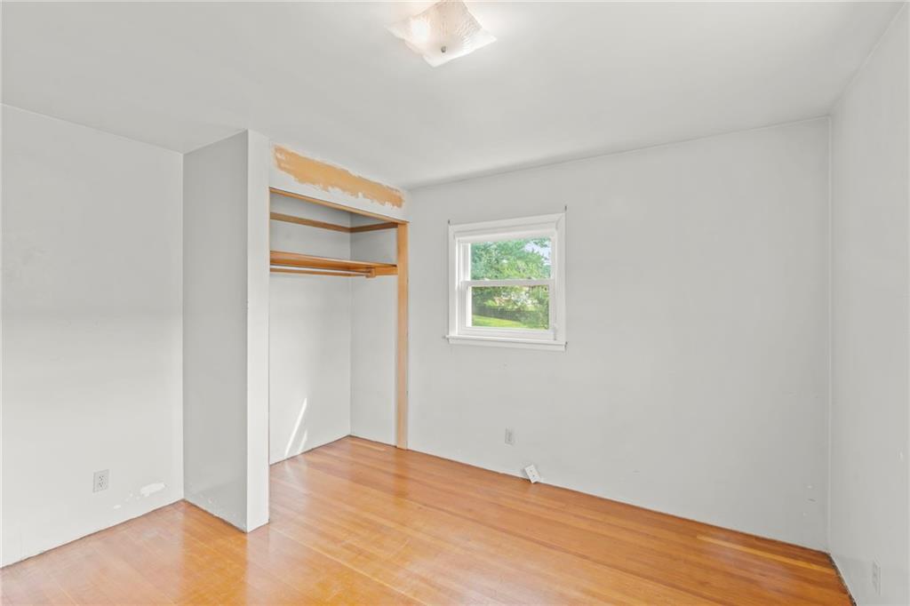 17 Ellen Drive McKees Rocks, PA 15136 - Photo 16 of 31 an empty room with wooden floor and windows