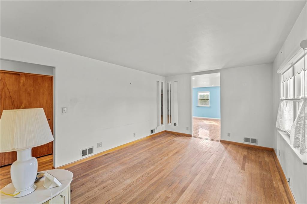 17 Ellen Drive McKees Rocks, PA 15136 - Photo 4 of 31 wooden floor in an empty room with a window