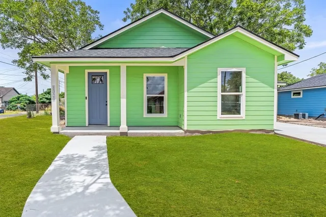 a front view of a house with a yard