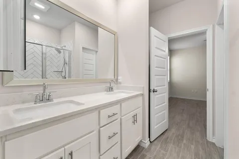a bathroom with a sink and a mirror
