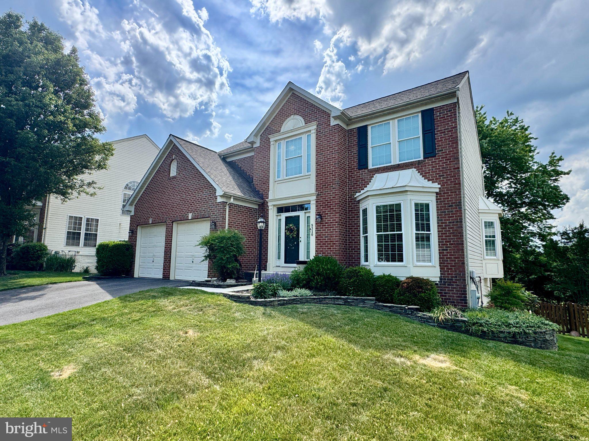 9310 Glen Vista Road Perry Hall, MD 21128 - Photo 1 of 2 a front view of a house with a yard and garage