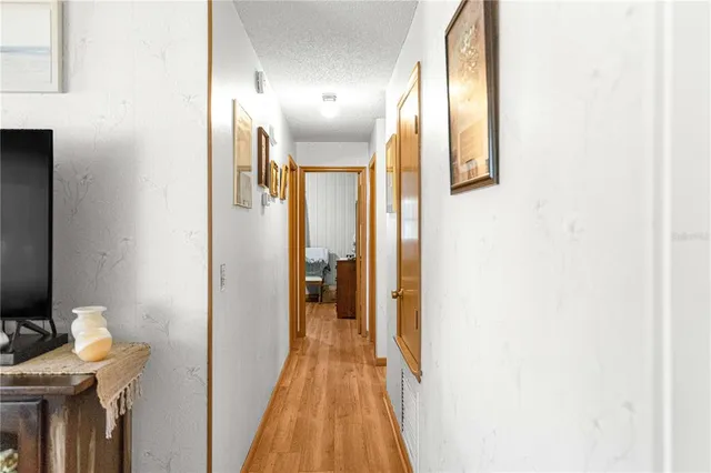 a view of a bathroom with a sink and a mirror