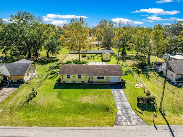 a view of swimming pool with seating area