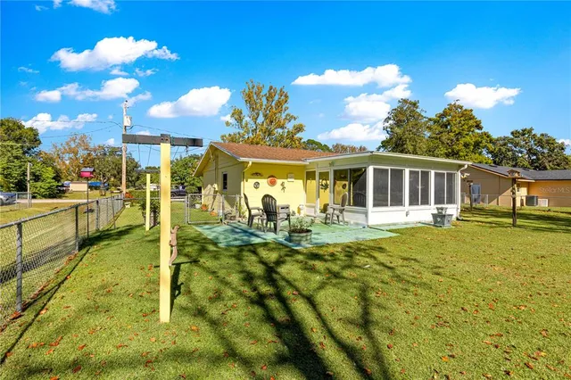 a view of a house with swimming pool