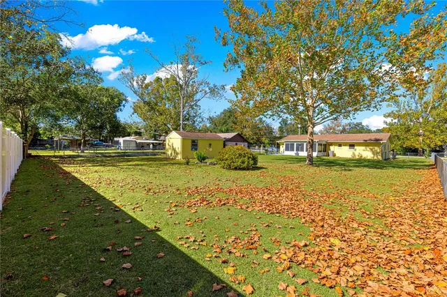 a view of a garden with a house