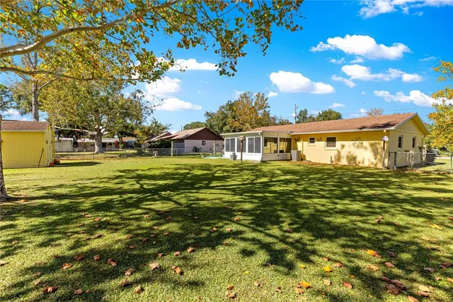 a view of a house with a big yard