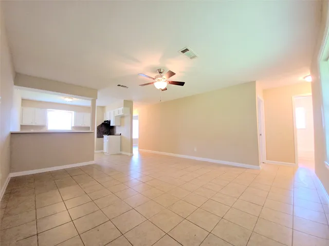 a view of an empty room and window