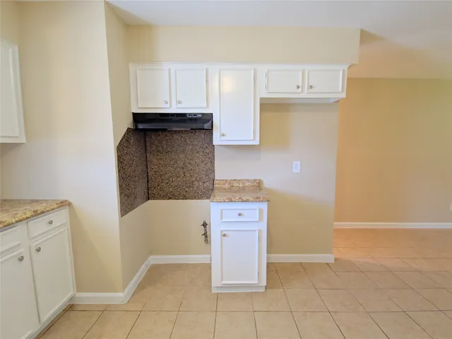 a kitchen with granite countertop a sink
