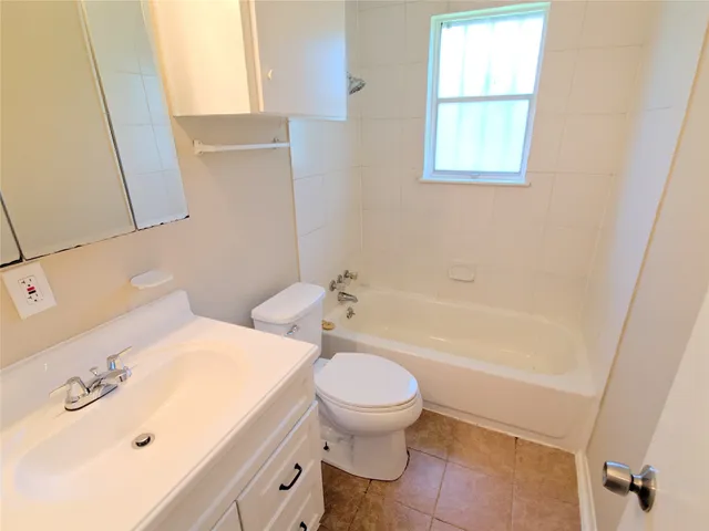 a bathroom with a sink a toilet and a bathtub