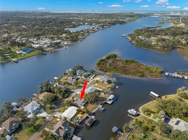 an aerial view of a house with a lake view